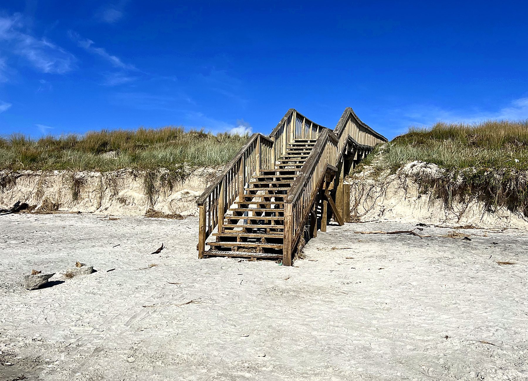 Steps over the dunes to the sand